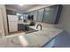 Kitchen with stainless steel sink and appliances, and updated cabinetry at 1818 S Quebec Way # 5-7, Denver, CO 80231