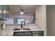 Modern kitchen featuring a stainless steel sink, elegant gray cabinets, and sleek countertops at 1818 S Quebec Way # 5-7, Denver, CO 80231