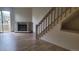 Bright living room featuring a fireplace, new floors, and a sliding door to the balcony at 1818 S Quebec Way # 5-7, Denver, CO 80231