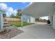 Backyard featuring a large covered area, a shed/garage and a well-maintained lawn at 6651 S Dudley Ct, Littleton, CO 80123