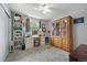 Bedroom featuring a storage cabinet and closet, desk and chair providing ample storage and functionality at 6651 S Dudley Ct, Littleton, CO 80123