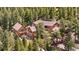 Stunning mountain home nestled among trees with multi-level decks and a separate guest house at 4618 Se Summit Trl, Evergreen, CO 80439