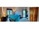Bedroom featuring a double bed, closet and ensuite bath at 4618 Se Summit Trl, Evergreen, CO 80439
