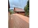 Large wooden deck perfect for outdoor entertaining and enjoying mountain views at 4618 Se Summit Trl, Evergreen, CO 80439