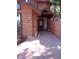 Inviting front entrance with a covered porch, stone walkway, and cozy bench seating at 4618 Se Summit Trl, Evergreen, CO 80439