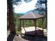 Mountain home gazebo has wood deck and beautiful mountain views at 4618 Se Summit Trl, Evergreen, CO 80439