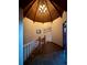 Hallway with stairs and wood railing at 4618 Se Summit Trl, Evergreen, CO 80439