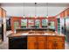 Gourmet kitchen featuring a large island, bar seating, and lots of countertop space at 4618 Se Summit Trl, Evergreen, CO 80439
