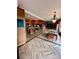 Kitchen and dining area with wood floors and large island with seating at 4618 Se Summit Trl, Evergreen, CO 80439