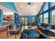 Spacious living room with high ceilings, wooden floors, and scenic views at 4618 Se Summit Trl, Evergreen, CO 80439