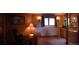 Cozy office with built-in shelving, warm lighting, and window at 4618 Se Summit Trl, Evergreen, CO 80439