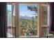 Scenic view from window featuring the mountains at 4618 Se Summit Trl, Evergreen, CO 80439
