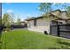 Backyard with lush green grass and a fenced-in yard at 2500 S Monroe St, Denver, CO 80210
