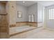 Luxurious bathroom featuring a soaking tub, separate shower, and elegant tile work at 2500 S Monroe St, Denver, CO 80210