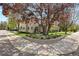 Landscaped corner lot featuring a beautiful mature tree and manicured lawn at 2500 S Monroe St, Denver, CO 80210
