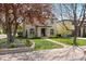Two-story home with meticulously maintained front yard and beautiful landscaping at 2500 S Monroe St, Denver, CO 80210