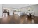 Open concept, showcasing modern finishes, a kitchen island, and hardwood floors at 2500 S Monroe St, Denver, CO 80210