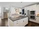 Bright kitchen features a large island with gas cooktop, stainless steel appliances, and ample cabinet space at 2500 S Monroe St, Denver, CO 80210