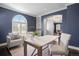 Home office with custom shelving, a designer light and comfortable seating at 2500 S Monroe St, Denver, CO 80210