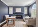 Home office with a modern fireplace and a large arched window with shutters at 2500 S Monroe St, Denver, CO 80210