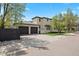 Rear exterior showcasing a three-car garage and well-maintained landscaping at 2500 S Monroe St, Denver, CO 80210