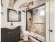 Finished basement bathroom with tiled shower, vanity, and modern fixtures at 3921 N Raleigh St, Denver, CO 80212