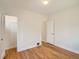 Bright, neutral bedroom with hardwood floors and white doors, ready for customization at 3921 N Raleigh St, Denver, CO 80212
