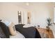 Bright bedroom features hardwood floors, accent ladder, and neutral decor at 3921 N Raleigh St, Denver, CO 80212
