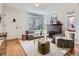 Cozy living room with a decorative fireplace and lots of natural light at 3921 N Raleigh St, Denver, CO 80212