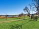 Rocky Mountain Lake Park with a scenic view, lush green lawn, and walking path at 3921 N Raleigh St, Denver, CO 80212