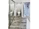 Updated bathroom with a walk-in shower and granite vanity at 2500 S Victor St # A, Aurora, CO 80014