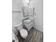 Clean bathroom with granite countertop, white vanity, and toilet at 2500 S Victor St # A, Aurora, CO 80014
