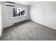 Bright bedroom with grey carpet and large window at 2500 S Victor St # A, Aurora, CO 80014