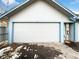 Attached garage with an automatic door opener at 2500 S Victor St # A, Aurora, CO 80014