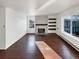 Living room with hardwood floors, fireplace and large windows at 2500 S Victor St # A, Aurora, CO 80014