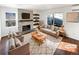 Virtually staged living room featuring a fireplace and hardwood floors at 2500 S Victor St # A, Aurora, CO 80014