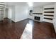 Bright living room with hardwood floors, fireplace, and built-in shelves at 2500 S Victor St # A, Aurora, CO 80014