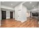 Finished basement featuring decorative sliding doors and hardwood flooring at 10731 E 151St Pl, Brighton, CO 80602
