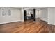 Spacious finished basement with hardwood floors, bar area, and ample lighting at 10731 E 151St Pl, Brighton, CO 80602