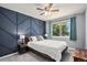 Beautiful bedroom with a stylish accent wall and plenty of natural light at 10731 E 151St Pl, Brighton, CO 80602