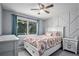 Charming bedroom with a large window and neutral color palette at 10731 E 151St Pl, Brighton, CO 80602