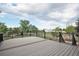 Spacious deck with black railing overlooking a beautifully landscaped yard at 10731 E 151St Pl, Brighton, CO 80602
