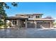 Beautiful two-story home boasting a three-car garage, covered porch, and landscaped front yard at 10731 E 151St Pl, Brighton, CO 80602