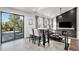 Cozy living room with modern decor, sleek fireplace, and walk out to deck at 10731 E 151St Pl, Brighton, CO 80602