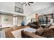 Spacious living room featuring hardwood floors, neutral tones, and access to the kitchen area at 10731 E 151St Pl, Brighton, CO 80602