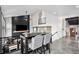 Open living room with high ceilings, fireplace, and modern finishes at 10731 E 151St Pl, Brighton, CO 80602
