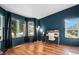 Bright home office space with large windows, wood floors, and modern desk at 10731 E 151St Pl, Brighton, CO 80602