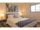 Bright bedroom featuring queen bed, side tables, and natural light from the window at 20600 Rangeview Dr, Morrison, CO 80465