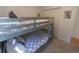 Cozy bedroom featuring gray bunk beds, ideal for or guests at 20600 Rangeview Dr, Morrison, CO 80465