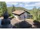 Mountain home featuring a charming exterior, a private driveway, and a zen garden at 20600 Rangeview Dr, Morrison, CO 80465